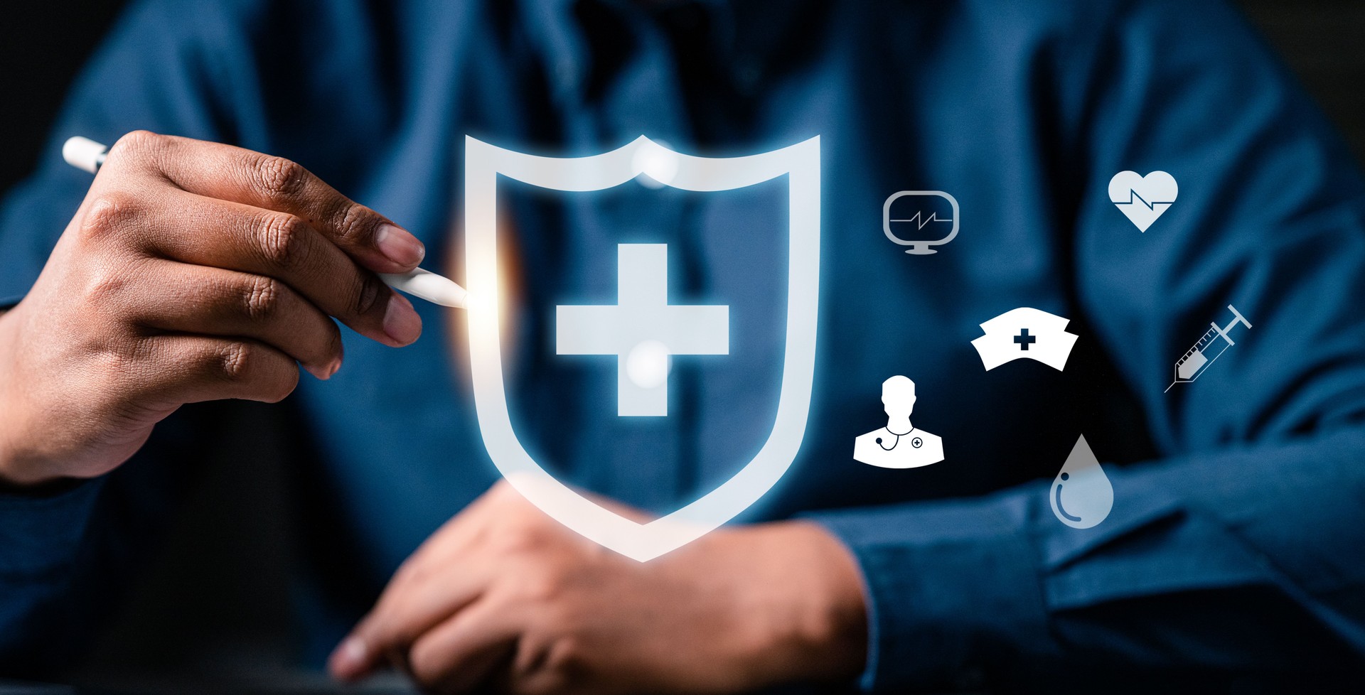 businessman use pen drawing shield hud and asset. the importance of insurance in the digital age.